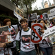Members of animal rights groups march during a protest against the fur industry, outside the venue for Hong Kong International Fur and Fashion Fair in Hong Kong February 28, 2015. The annual Hong Kong International Fur and Fashion Fair is the world's largest fur fashion event, which brought $232 million (HK$1.8 billion) in exports in 2014, with 75 per cent of the world's fur and fur garments re-exported through the city, according to the Hong Kong Fur Federation. REUTERS/Tyrone Siu (CHINA - Tags: ANIMALS BUSINESS ENVIRONMENT FASHION CIVIL UNREST) - GM1EB2S1FFR01